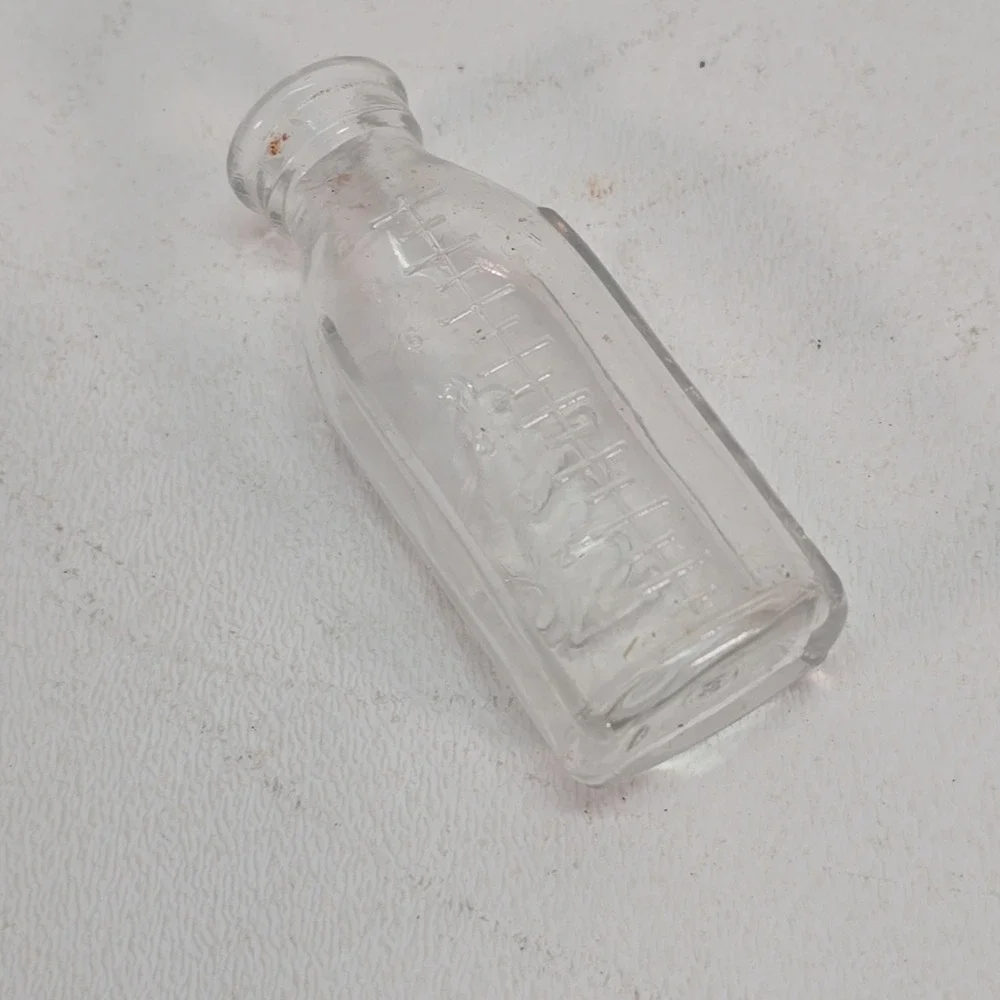 Vintage Glass Baby Doll Bottle Embossed Dog Wetting toy
